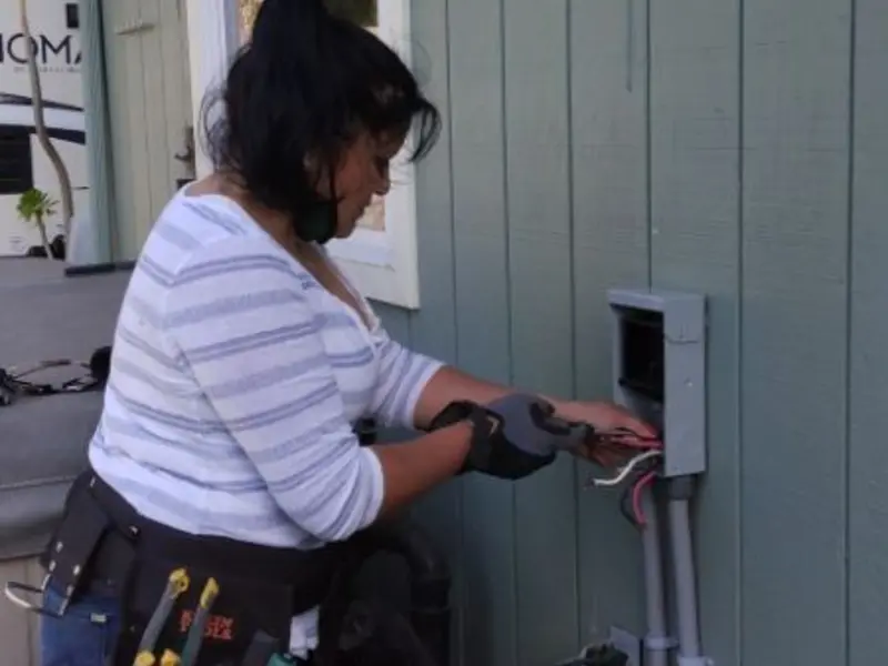 Licensed electrician wiring an exterior subpanel in Tulia